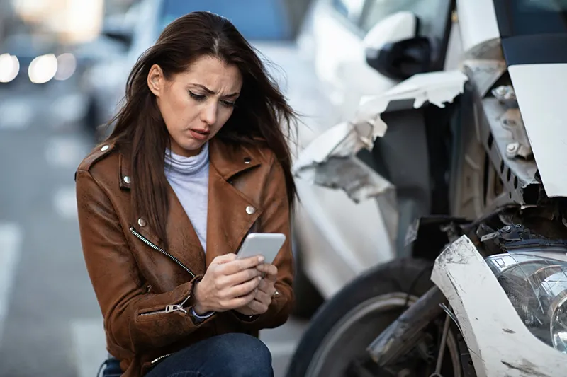 Lady calling NScott Accident Repair after an accident